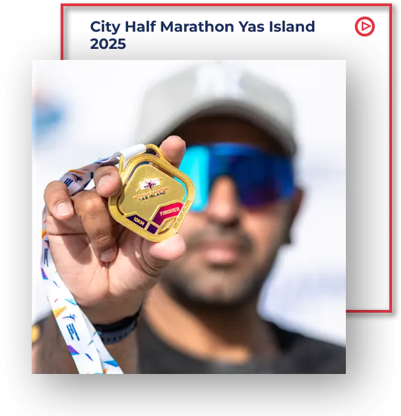 A hand holds a gold medal with a colorful ribbon, celebrating achievement at the City Half Marathon Yas Island 2025.