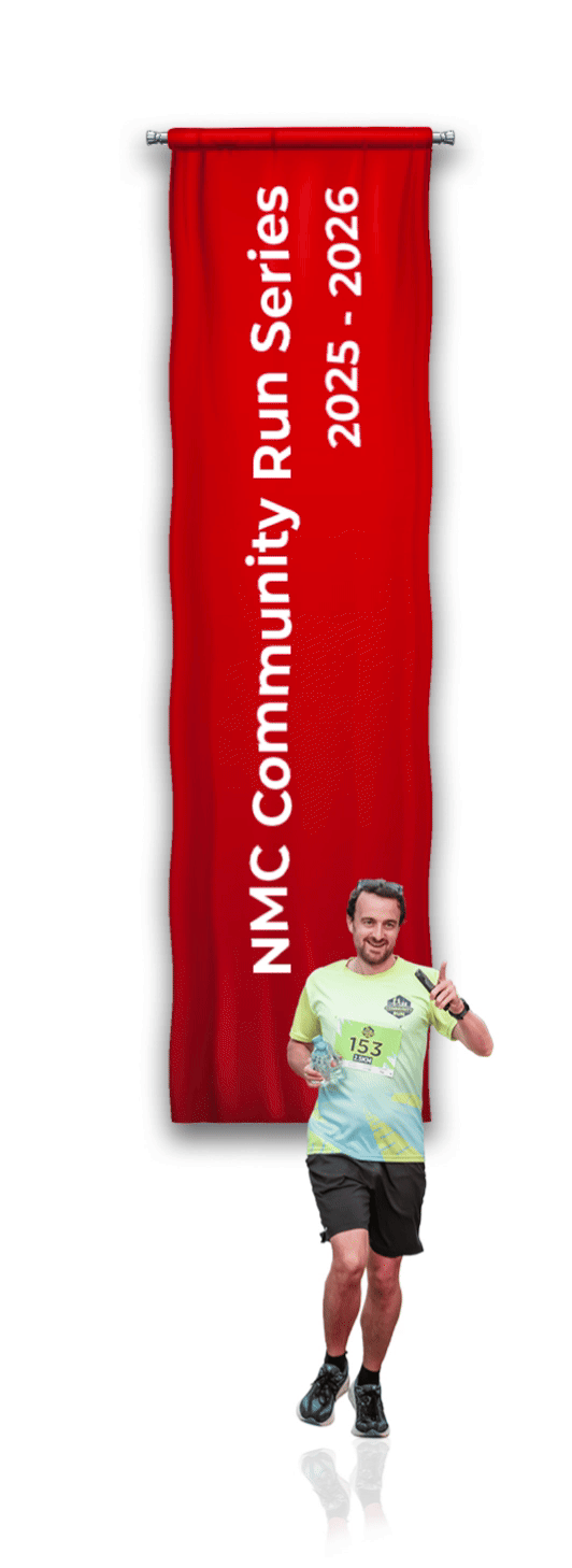 A man is running and a NMC Community Run Series Flag behind it