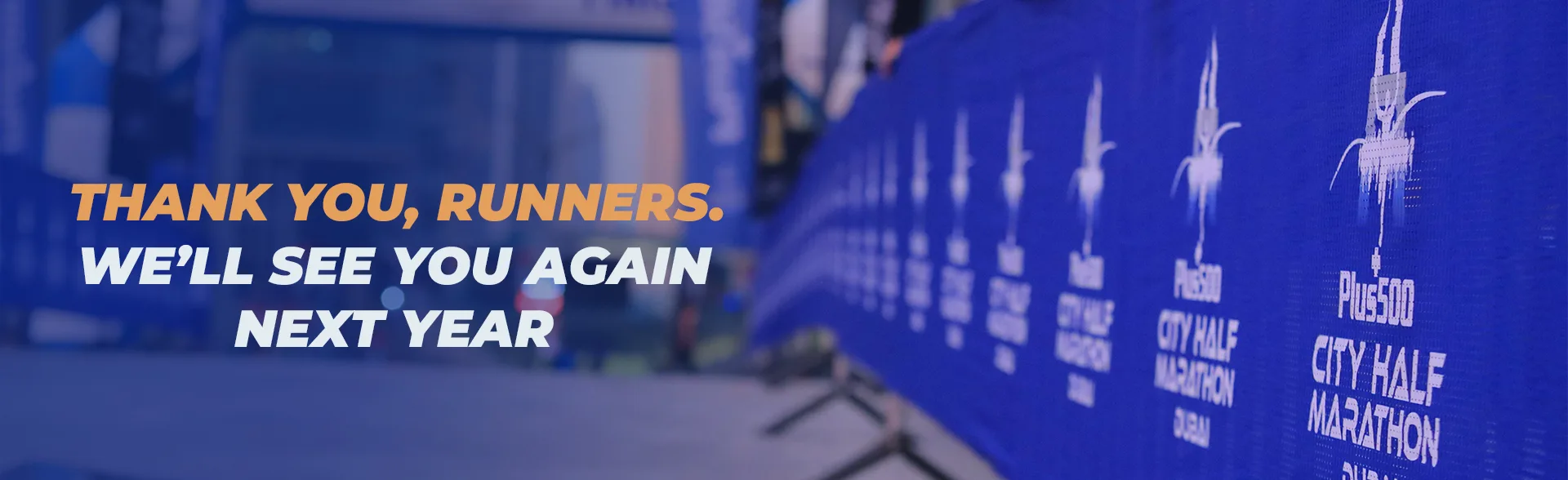 A banner thanking runners for participating, promoting the Plus500 City Half Marathon and inviting them to return next year.
