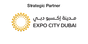 Logo for Expo City Dubai, labeled as Strategic Partner, featuring a circular design with dots and Arabic script.