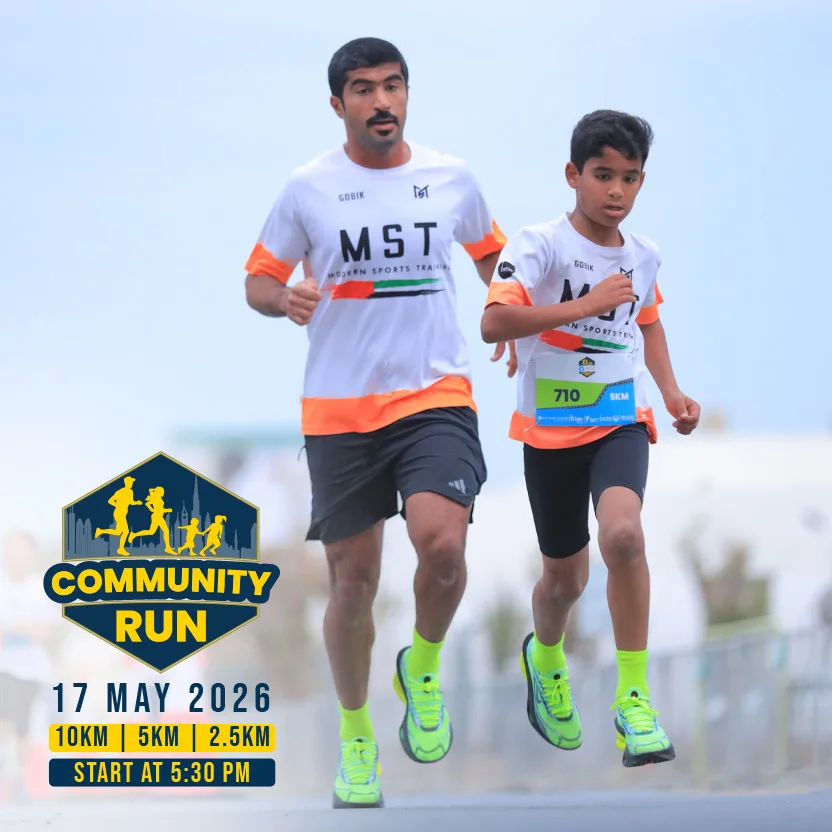 Two runners, an adult and a child, wearing MST shirts and neon shoes, participating in a community run event on May 17, 2026.