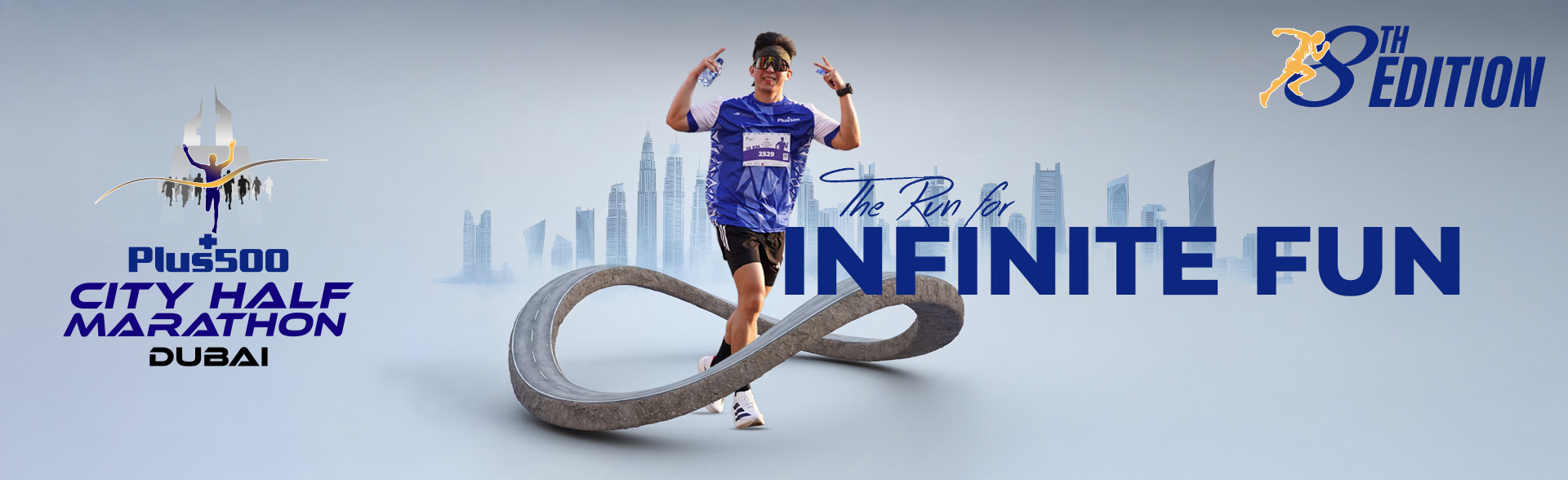 Runner crossing an infinity loop road with Dubai skyline, promoting Plus500 City Half Marathons 8th edition and theme The Run for Infinite Fun.